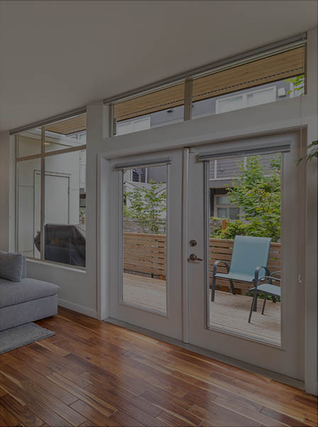 Impact-rated French doors opening to a patio